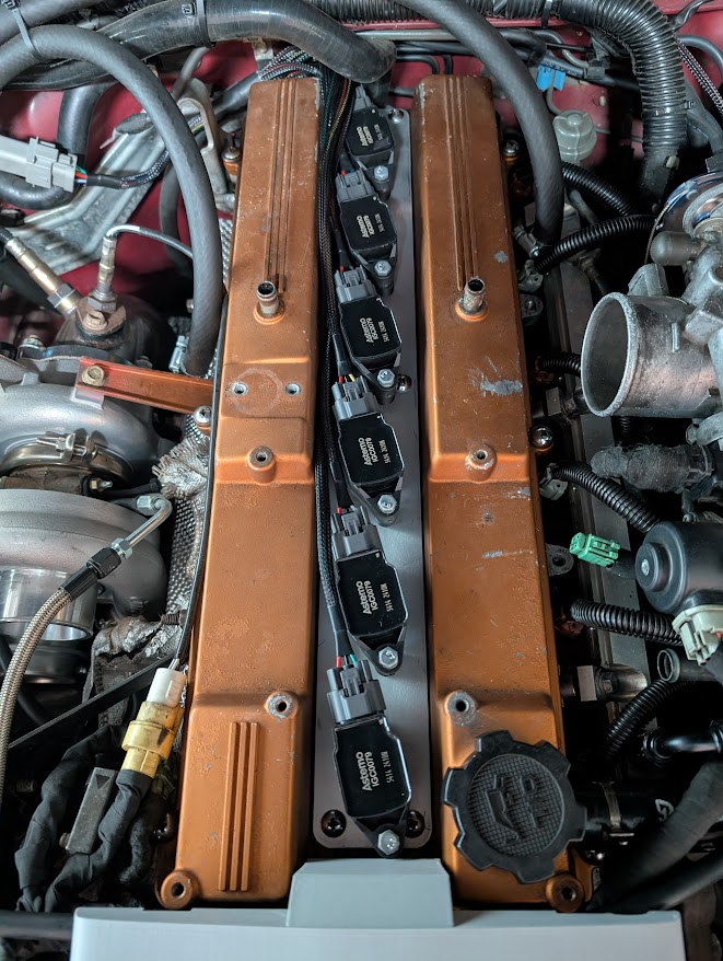 7MGTE engine bay with R35 coil conversion installed